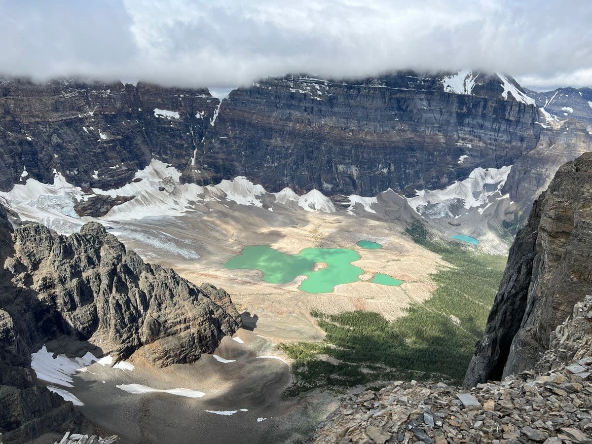 Turquoise alpine lake surrounded by mountains